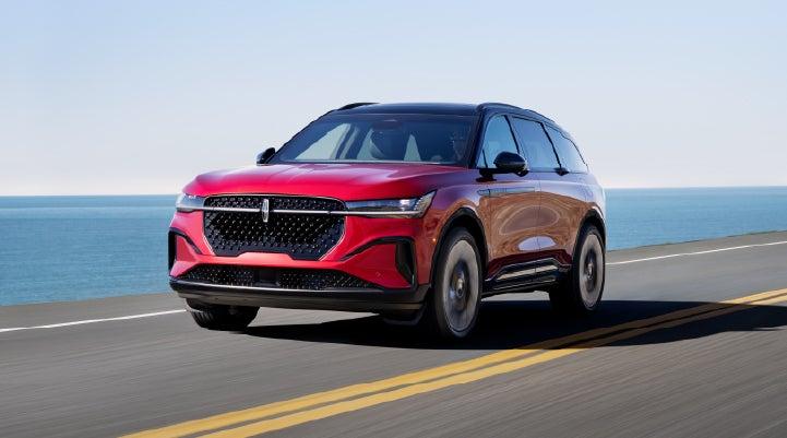 A 2025 Lincoln Nautilus® SUV is being driven on a seaside roadway. | Doral Lincoln in Doral FL