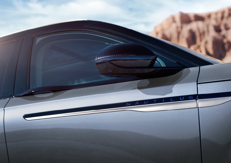 Blue lettering on the side of the vehicle that reads nautilus indicates the available hybrid powertrain. | Doral Lincoln in Doral FL