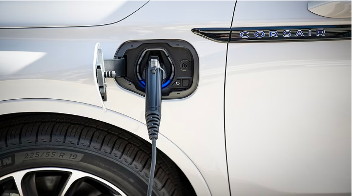 An electric charger is shown plugged into the charging port of a Lincoln Corsair® Grand Touring
model. | Doral Lincoln in Doral FL