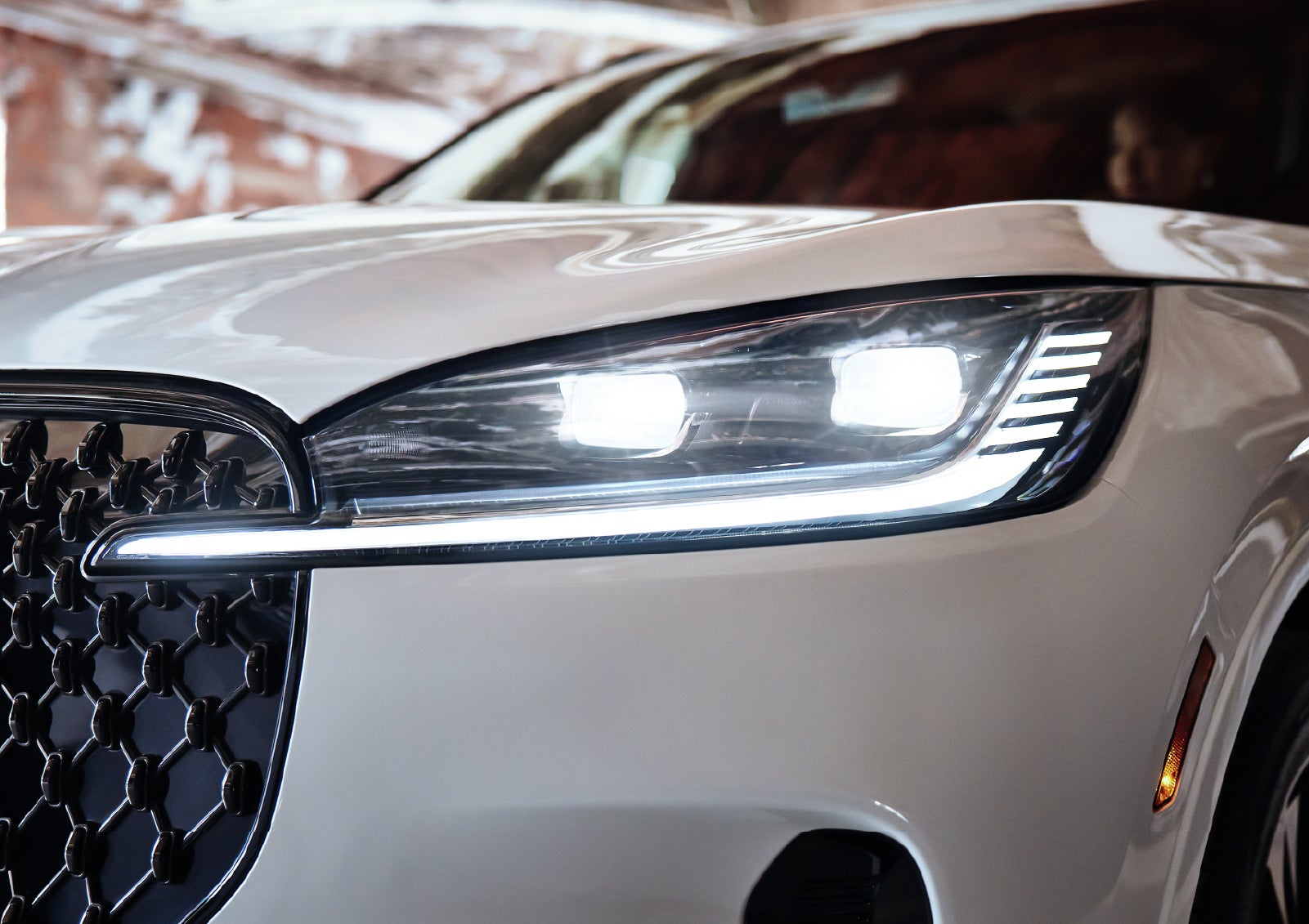 A close-up of a headlamp on the 2027 Lincoln Aviator® SUV is shown. | Doral Lincoln in Doral FL