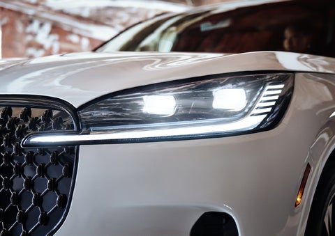 A close-up of a headlamp on the 2027 Lincoln Aviator® SUV is shown. | Doral Lincoln in Doral FL