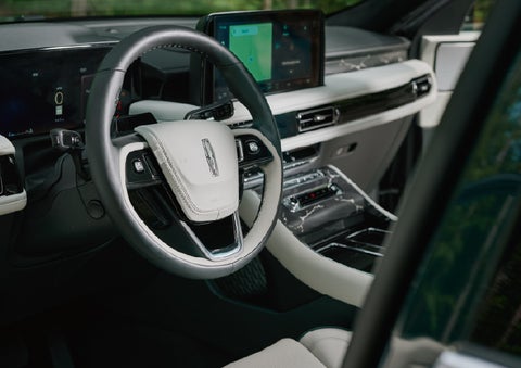 The leather-trimmed steering wheel of a 2027 Lincoln Aviator® Black Label™ SUV. | Doral Lincoln in Doral FL