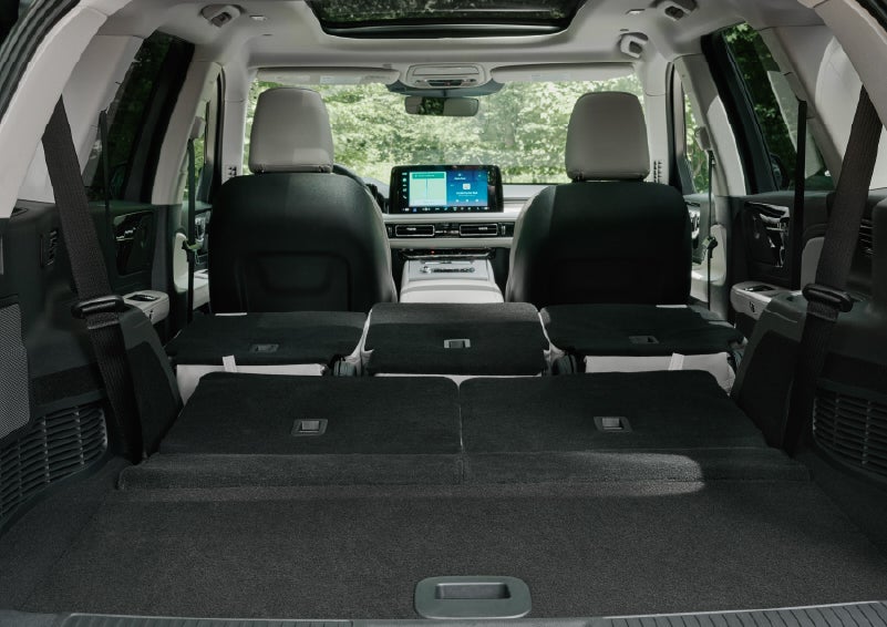 A rear to front view of the interior of a 2027 Lincoln Aviator® Black Label™ SUV shows the third and second rows folded flat | Doral Lincoln in Doral FL
