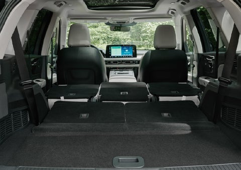 A rear to front view of the interior of a 2027 Lincoln Aviator® Black Label™ SUV shows the third and second rows folded flat | Doral Lincoln in Doral FL